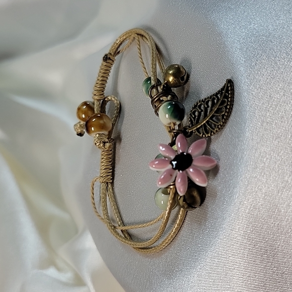 Hand-knotted Hemp Bracelet, ceramic beads, flower; charm, choice of color - Picture 2 of 6
